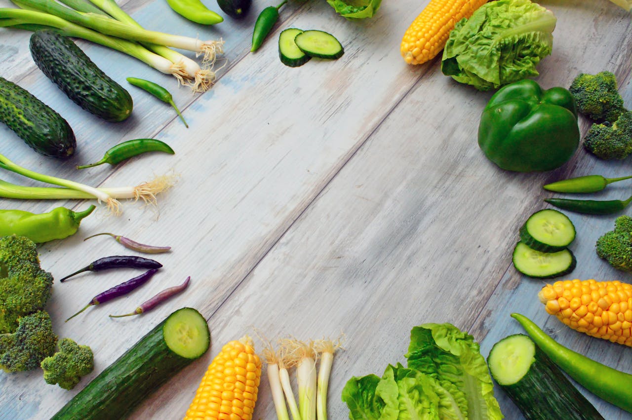 gallery-03 An assortment of fresh vegetables on a wooden table, perfect for healthy cooking.