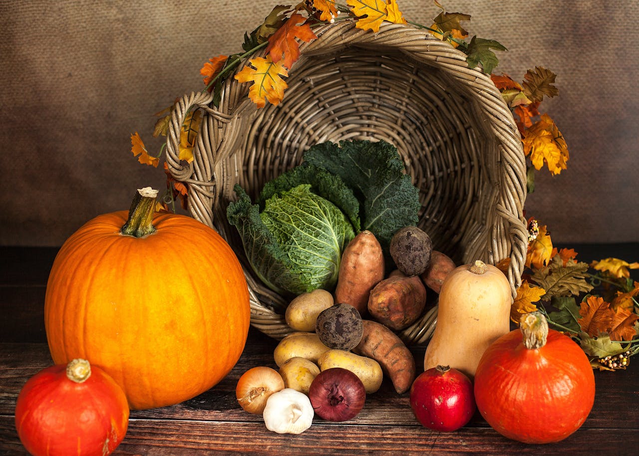 gallery-04 A rustic cornucopia overflowing with fresh autumn vegetables, symbolizing abundance and harvest.